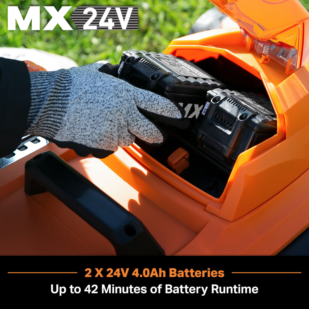 LawnMaster lawn mower with MX 24V branding and a gloved hand inserting a battery pack.