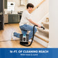 A man kneels on a wooden floor while using a cordless carpet cleaner with a hose and cord to clean carpeted stairs in a home. A blue banner at the bottom reads '16-FT.