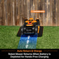 Robot lawn mower on a charging dock with grass and wooden fence background