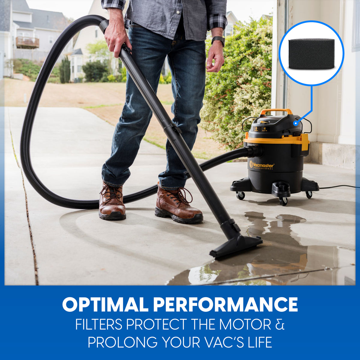 Person cleans up a spill in a garage with wet/dry vacuum