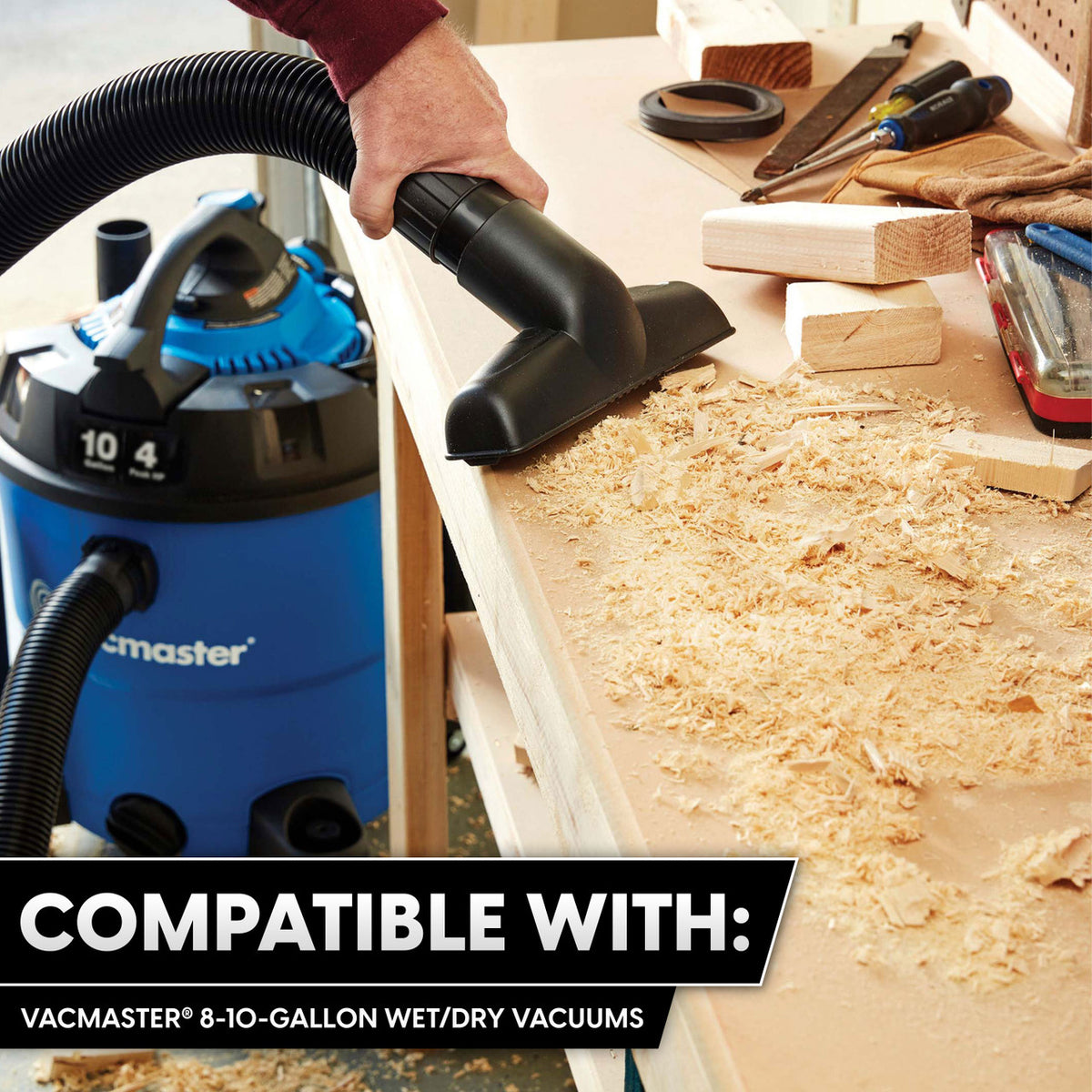 VacMaster 8-10 gallon wet/dry vacuum with brush attachment cleaning wood sawdust from workbench.