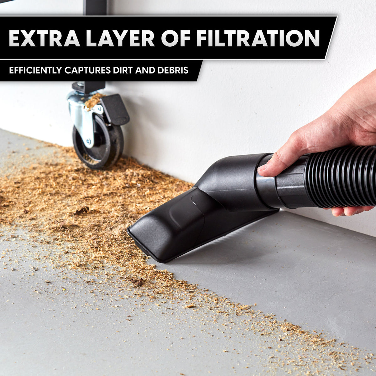 Vacuum hose with floor brush attachment demonstrating extra layer filtration capturing dirt and debris.