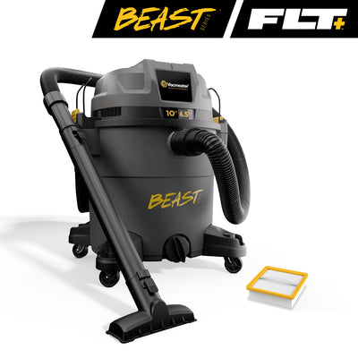 Black FLT+ wet/dry vacuum on a while background, a filter sits on the floor next to it