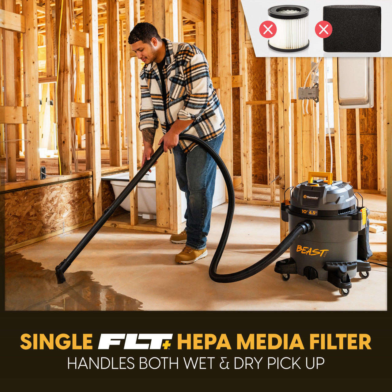 A man vacuuming with the wet/dry vacuum on a construction site