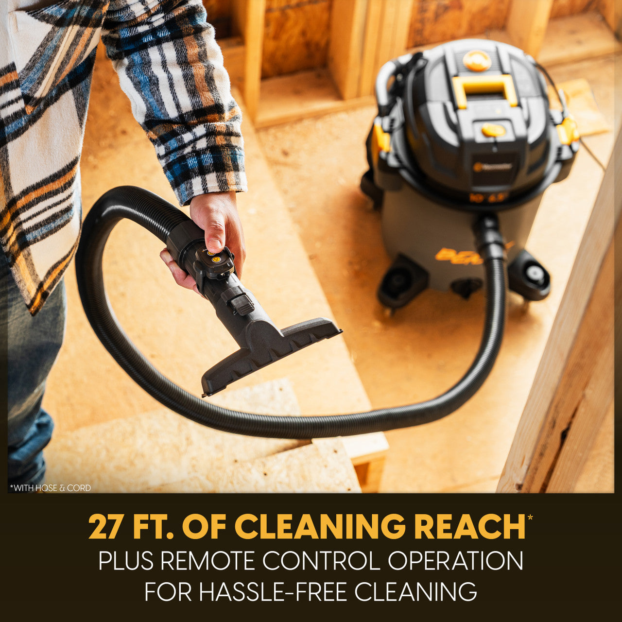 27ft of cleaning reach. A close-up of a finger pressing a button on the vacuum remote control