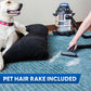 Image of a dog laying on a dog bed watching a person vacuum up pet hair from a rug, with stainless steel wet/dry vacuum in the background. Text reads, "pet hair rake included."