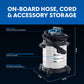 Image of stainless steel wet/dry vacuum on black background with measurements shown of 21" tall, 16" wide, 16" deep. Text reads, "on-board hose, cord and accessory storage. Rear port for easy blower conversion. Compact stainless steel design for easy storage. Rotating casters for added maneuverability."