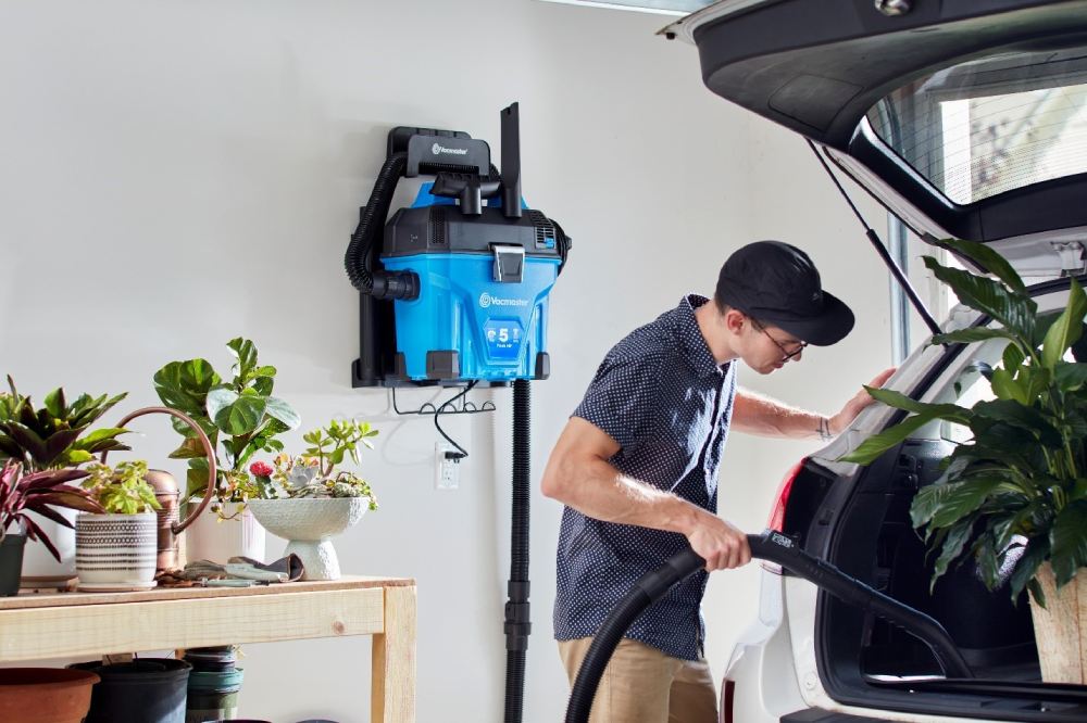 Vacmaster wall mount wet dry vac cleaning a car trunk
